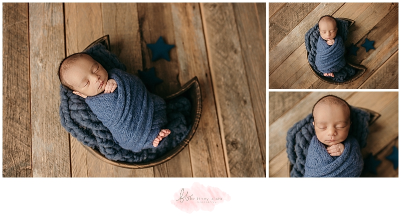 baby boy wrapped in blue with toes peeking out